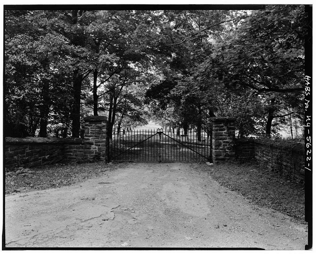 Tree-lined entrance gate to The Meadows estate in Rhinebeck